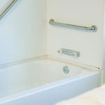 bathtub with grab bars in activities of daily living room